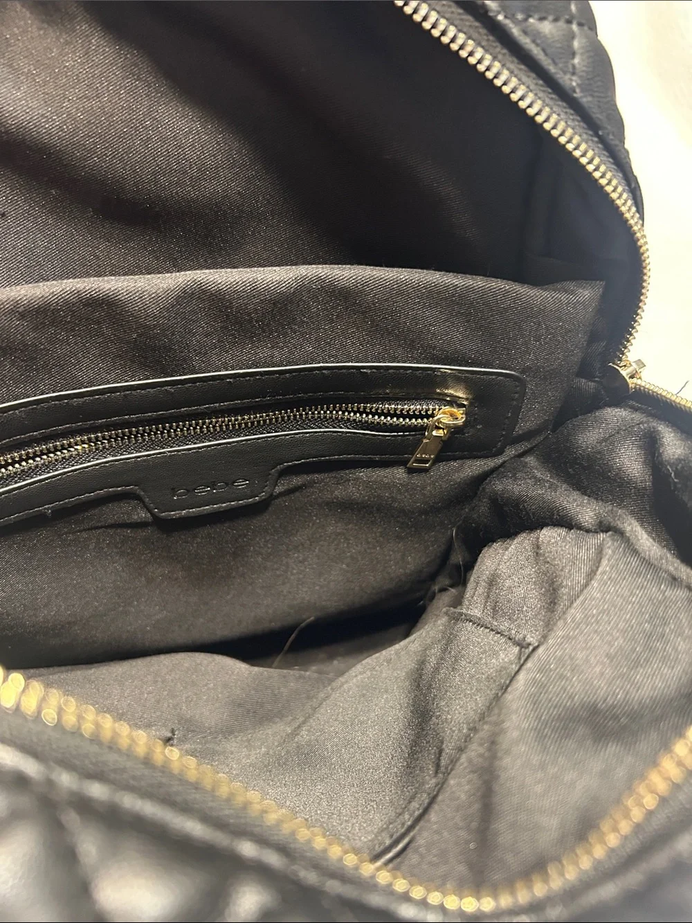 bebe Black Quilted Leather Backpack with Gold Plate